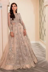 Get ready to lost in the world with floral and trendy designs. This dress is beautifully decorated with heavy embroidery. It is highlighted with kora, dabka, tilla, sequins and pearls. The shirt is enhanced with zardozi work on a jewel neckline. It comes with a plain lehenga in the same colour to balance the beautiful outfit. It is coordinated with a tissue dupatta which is sprinkled with sequins all over it. It is further furnished with a four-sided embellished border giving a perfectly glamorous look to the whole nikah wear. 