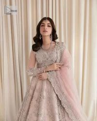 Rose Pink, is the colour of confidence on your big day. The blouse in the rose pink shade is embellished with intricate designs, silverwork, and fine details. The V shape neckline and full sleeves look perfect with the lehenga. Beautiful details of crystals, tilla, dabka, kora, stones, and dabka give a perfect finishing look to the following blouse. It is organized with a lehenga which is heavily adorned with silver embroidery to add more charm and beauty to the outfit. Complete this outfit with a dupatta framed with four-sided borders that gives an elegant look to the gorgeous bride.