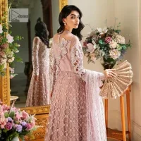Incoming: that nikkah feeling with some flowers. Unique maxi for nikkah outfit in soft pink colour is embellished with silver pearls sequins, kora, dabka, tilla, Zardozi and Kundan work. Maxi Sleeves are fully embellished with embroidery and are in floral patterns. The Jewel neckline also makes this masterpiece unique and charming. Maxi Hemline is decorated with embroidery on the border. Further, the front open style makes it a perfect choice to pair with the dupatta. It is organized with a plain lehenga to balance the overall outfit. Complete this article with a dupatta framed with four-sided embellished scalloped borders and sequins sprayed all over.