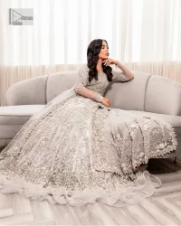 Enter the world of allurement with steel grey, a gorgeous go-to dress for nikah to make you look classy and fabulous at the same time! The delicate details of this gorgeous bridal dress are from exquisite patterns observed in silver embroidery which is prominent with tilla, dabka, kora, Kundan, Zardozi and the real magic of crystals. The house has V shape neckline to make this masterpiece a little romantic and classy. Further, full sleeves are fully designed with fantastic floral patterns spread all over. It is paired with a lehenga having frilled to complete the lavish look of this fully embellished nikah wear. Complete this article with a dupatta adorned with four-sided embellished borders and sequins sprayed all over.