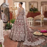 It’s regal, it’s rich, it’s festive. This magnificent nikah outfit is hand-embellished with luxury designs and beautiful silverwork which is highlighted with tilla, dabka, kora, Kundan and details of Zardozi. The boat shape neckline making this attire your foremost priority to wear on the most important day of your life. Further, the full sleeves of the blouse also decorated with beautiful embroidery It is coordinated with scalloped lehenga which is heavily embellished. Intricate designs and fine details of lehenga give a perfect finishing look to this masterpiece. Complete this outfit with dupatta in the same colour. The dupatta is in delicate heavy embellished border gives an exquisite look to the gorgeous bride. The scalloped borders of this dupatta give a stylish touch to this outfit.