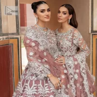 It’s regal, it’s rich, it’s festive. This magnificent nikah outfit is hand-embellished with luxury designs and beautiful silverwork which is highlighted with tilla, dabka, kora, Kundan and details of Zardozi. The boat shape neckline making this attire your foremost priority to wear on the most important day of your life. Further, the full sleeves of the blouse also decorated with beautiful embroidery It is coordinated with scalloped lehenga which is heavily embellished. Intricate designs and fine details of lehenga give a perfect finishing look to this masterpiece. Complete this outfit with dupatta in the same colour. The dupatta is in delicate heavy embellished border gives an exquisite look to the gorgeous bride. The scalloped borders of this dupatta give a stylish touch to this outfit.