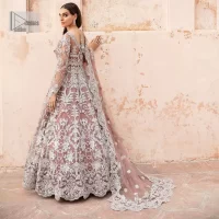 It’s regal, it’s rich, it’s festive. This magnificent nikah outfit is hand-embellished with luxury designs and beautiful silverwork which is highlighted with tilla, dabka, kora, Kundan and details of Zardozi. The boat shape neckline making this attire your foremost priority to wear on the most important day of your life. Further, the full sleeves of the blouse also decorated with beautiful embroidery It is coordinated with scalloped lehenga which is heavily embellished. Intricate designs and fine details of lehenga give a perfect finishing look to this masterpiece. Complete this outfit with dupatta in the same colour. The dupatta is in delicate heavy embellished border gives an exquisite look to the gorgeous bride. The scalloped borders of this dupatta give a stylish touch to this outfit.