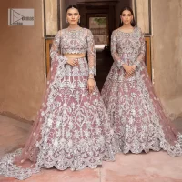 It’s regal, it’s rich, it’s festive. This magnificent nikah outfit is hand-embellished with luxury designs and beautiful silverwork which is highlighted with tilla, dabka, kora, Kundan and details of Zardozi. The boat shape neckline making this attire your foremost priority to wear on the most important day of your life. Further, the full sleeves of the blouse also decorated with beautiful embroidery It is coordinated with scalloped lehenga which is heavily embellished. Intricate designs and fine details of lehenga give a perfect finishing look to this masterpiece. Complete this outfit with dupatta in the same colour. The dupatta is in delicate heavy embellished border gives an exquisite look to the gorgeous bride. The scalloped borders of this dupatta give a stylish touch to this outfit.