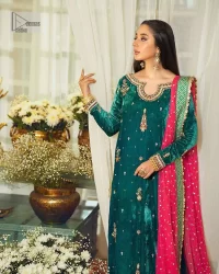 Brighten up your day with this beautiful ensemble. This long shirt style in a teal green colour is a perfect outfit that gives you a royal look on the festive occasion. The embroidered neckline and full sleeves make this outfit an epitome of beauty. Further, Embroidery work which enhances with tilla, dabka, kora, Kundan and lavish designs makes this outfit your priority for the day. It is paired with plum trousers which have finished edges to balance the overall look of the day. Complete this party wear with a dupatta in pink colour sparkling sequins spray all over. 