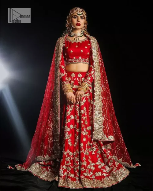 Reception called, and red answered. The stunning blouse is embellished with floral motifs. The base colour used for choli is