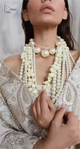 Get this ever-trending floral walima outfit.  Keep it romantic and fantastic with the DeemasFashion latest articles! The soft green blouse is gracefully embellished with silver and gold embroidery that gives you a head-turning appearance on the wedding day. The blouse is enhanced with tilla, dabka, kora, Kundan, and crystals. The off-shoulder neckline of the blouse makes this stunning attire an epitome of royalty and grace. It is paired with a flared lehenga that is also adorned with embroidery to make your day fantastic. Complete this article with a dupatta framed with four-sided embellished borders and sequins sprayed all over.