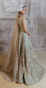 Get this ever-trending floral walima outfit.  Keep it romantic and fantastic with the DeemasFashion latest articles! The soft green blouse is gracefully embellished with silver and gold embroidery that gives you a head-turning appearance on the wedding day. The blouse is enhanced with tilla, dabka, kora, Kundan, and crystals. The off-shoulder neckline of the blouse makes this stunning attire an epitome of royalty and grace. It is paired with a flared lehenga that is also adorned with embroidery to make your day fantastic. Complete this article with a dupatta framed with four-sided embellished borders and sequins sprayed all over.