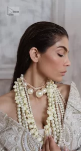 Get this ever-trending floral walima outfit.  Keep it romantic and fantastic with the DeemasFashion latest articles! The soft green blouse is gracefully embellished with silver and gold embroidery that gives you a head-turning appearance on the wedding day. The blouse is enhanced with tilla, dabka, kora, Kundan, and crystals. The off-shoulder neckline of the blouse makes this stunning attire an epitome of royalty and grace. It is paired with a flared lehenga that is also adorned with embroidery to make your day fantastic. Complete this article with a dupatta framed with four-sided embellished borders and sequins sprayed all over.