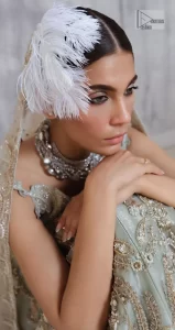 Get this ever-trending floral walima outfit.  Keep it romantic and fantastic with the DeemasFashion latest articles! The soft green blouse is gracefully embellished with silver and gold embroidery that gives you a head-turning appearance on the wedding day. The blouse is enhanced with tilla, dabka, kora, Kundan, and crystals. The off-shoulder neckline of the blouse makes this stunning attire an epitome of royalty and grace. It is paired with a flared lehenga that is also adorned with embroidery to make your day fantastic. Complete this article with a dupatta framed with four-sided embellished borders and sequins sprayed all over.