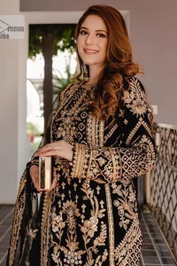 Intricate floral patterns all over! Make a style statement with this elegant embroidered long shirt adorned with golden embroidery decorated with sequins, tilla, dabka, kora, Kundan, heavily embellished bodice, and floral bunches. The round neckline of the following shirt makes this article stunning and charming. The full sleeves of the shirt are also magnified with floral motifs. It is paired up with trousers in the same colour to balance the overall look of this party wear. Complete this outfit with a dupatta framed with four-sided borders and tiny floral motifs all over which is exactly a pure trendy style.