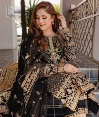 Intricate floral patterns all over! Make a style statement with this elegant embroidered long shirt adorned with golden embroidery decorated with sequins, tilla, dabka, kora, Kundan, heavily embellished bodice, and floral bunches. The round neckline of the following shirt makes this article stunning and charming. The full sleeves of the shirt are also magnified with floral motifs. It is paired up with trousers in the same colour to balance the overall look of this party wear. Complete this outfit with a dupatta framed with four-sided borders and tiny floral motifs all over which is exactly a pure trendy style.