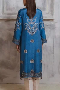 Dress up in this finest two-piece aesthetic party wear. A beautiful shirt in a cadet blue colour is a perfect choice to pair with trousers. The shirt is emblazoned with embroidery, threads, and floral designs. Hand-crafted details of tilla, dabka, Kora and Zardozi make this shirt a ravishing masterpiece. The round neckline is also decorated with attractive embroidery Furter, and the floral patterns on the sleeves give a handsome touch to the following shirt. It is systemized with plain ivory trousers to make a perfect combination which is a perfect choice.