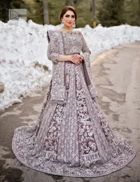 This enchanting ensemble features intricate embroidery of tilla, dabka, kora, and Kundan in silver, gray, and multiple shades, making it a symbol of