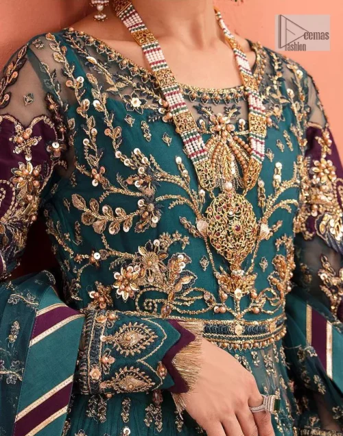 Mark your presence in this elegant Mehndi outfit. The front open scalloped pishwas in the teal green shade are adorned
