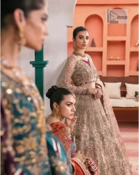 Mark your presence in this elegant Mehndi outfit. The front open scalloped pishwas in the teal green shade are adorned with hand-crafted details of tilla, dabka, Kora, Kundan and the real magic of Zardozi. It is further enhanced with golden embroidery to give a royal touch to this outstanding pishwas. The floral matters on full sleeves enhance the beauty of the outfit. In addition to this, the round neckline style of the following pishwas is absolutely breathtaking. It is paired with crushed lehenga n the same colour to enable the fairness of the outfit. Complete this stunning dress with a dupatta framed with a four-sided border to highlight your presence.