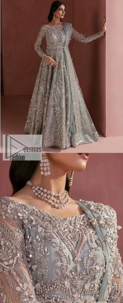 A timelessly classic and hot Nikah wear. DeemasFashion presents the flared maxi in grey colour which is heavily adorned with silver embroidery which is prominent with tilla, dabka, Kora, Kundan and the details of crystals. The boat shape neckline gives a super glamorous touch to the outfit. in addition to this, the floral patterns on full sleeves make this article lovely and romantic. A perfect outfit for an everlasting majestic look is paired up with a dupatta in the same colour framed with four-sided embellished borders and tiny floral motifs all over to give it a perfect royal look.