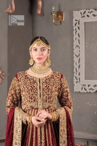Bold and classy colour for the reception outfit! The maroon gown is breathtakingly adorned with hand-crafted embellishments and intricate designs. It is enhanced with tilla, dabka, Koran, Kundan and details of Zardozi. The round neckline is emblazoned with golden embroidery to make this masterpiece romantic. The full sleeves of the following scalloped gown are adorned with fine details. It is paired with flared lehenga which is also heavily embellished giving a royal look to the gorgeous bride. Finish this maroon outfit with a dupatta which is ornamented with four-sided borders and sequins sprayed all over to create an exquisite dress.