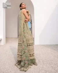 The timelessly classic mint green nikah outfit! The beautiful model looks ravishing in this mint green shirt, heavily hand-embellished with floral motifs and sequins spray. The back of the shirt is sprayed with sequins and has an embellished border; an embellished front and back panel border makes this outfit unique. The V shape neckline adds super beauty to the outfit which involves tilla, dabka, kora, Kundan and the real magic of crystals. Further, the sleeveless style is for extra comfort zone. It is paired with a flared lehenga with an intricately embellished border. 