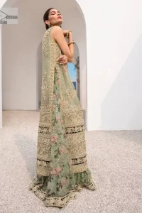 The timelessly classic mint green nikah outfit! The beautiful model looks ravishing in this mint green shirt, heavily hand-embellished with floral motifs and sequins spray. The back of the shirt is sprayed with sequins and has an embellished border; an embellished front and back panel border makes this outfit unique. The V shape neckline adds super beauty to the outfit which involves tilla, dabka, kora, Kundan and the real magic of crystals. Further, the sleeveless style is for extra comfort zone. It is paired with a flared lehenga with an intricately embellished border. 