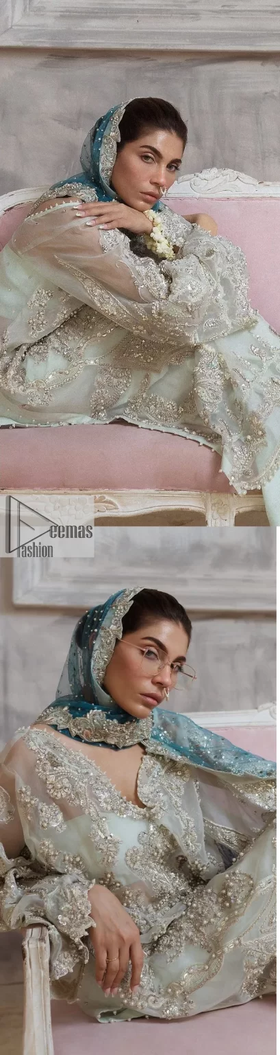 It’s bright, it's bold, it’s crosshatch. DeemasFashion presents the soft green and teal blue combo party outfit. The long shirt is heavily adorned with tilla,dabka, Kora, Kundan and the magical details of Zardozi. It is prominent with fine details of silver embroidery. The V neckline has delicate handwork to enhance the masterpiece. Further, the full sleeves also add super beauty to the outfit. It is paired up with plain trousers and a blouse to balance the overall outfit so that you are just the shining star of the show. Complete this handsome look with teal blue dupatta which is embellished with four-sided borders and sequins sprayed all over.