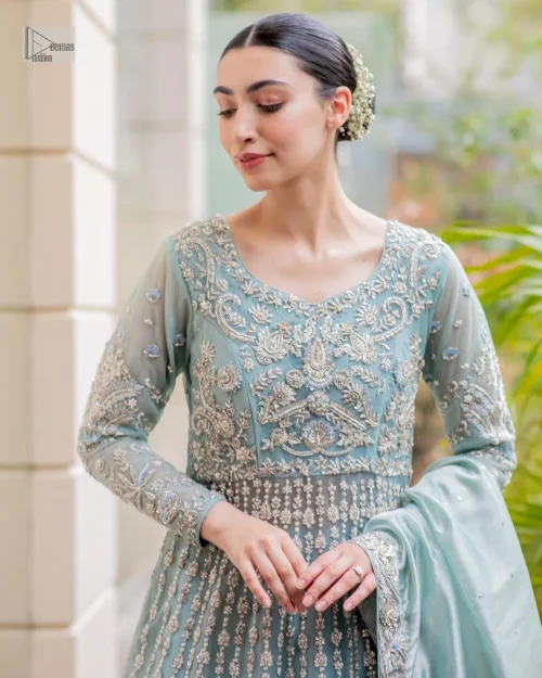 Introducing our stunning sky-blue Walima outfit, a masterpiece of artistry and elegance. This attire showcases a harmonious fusion of traditional