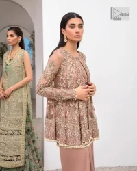 Rich shades and stunning details of party outfit – you’ll be making heads turn. A 2 pc outfit with a short front open shirt, full sleeves with floral pattern and embellishments on organza fabric; the asymmetrically placed designs are studded with golden and silver embroidery which is further highlighted with tilla, dabka, kora, Kundan and the intricate details of Zardozi. The embellished neckline has the finest details. It is paired up with the inner shirt that is also embellished to make this luxury attire unique. To complete the outfit the plain lehenga paired, just to fulfil your diva look.
