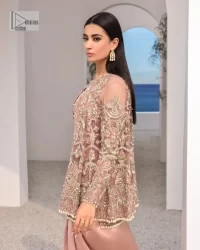 Rich shades and stunning details of party outfit – you’ll be making heads turn. A 2 pc outfit with a short front open shirt, full sleeves with floral pattern and embellishments on organza fabric; the asymmetrically placed designs are studded with golden and silver embroidery which is further highlighted with tilla, dabka, kora, Kundan and the intricate details of Zardozi. The embellished neckline has the finest details. It is paired up with the inner shirt that is also embellished to make this luxury attire unique. To complete the outfit the plain lehenga paired, just to fulfil your diva look.