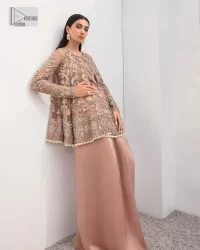 Rich shades and stunning details of party outfit – you’ll be making heads turn. A 2 pc outfit with a short front open shirt, full sleeves with floral pattern and embellishments on organza fabric; the asymmetrically placed designs are studded with golden and silver embroidery which is further highlighted with tilla, dabka, kora, Kundan and the intricate details of Zardozi. The embellished neckline has the finest details. It is paired up with the inner shirt that is also embellished to make this luxury attire unique. To complete the outfit the plain lehenga paired, just to fulfil your diva look.