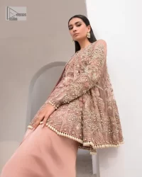 Rich shades and stunning details of party outfit – you’ll be making heads turn. A 2 pc outfit with a short front open shirt, full sleeves with floral pattern and embellishments on organza fabric; the asymmetrically placed designs are studded with golden and silver embroidery which is further highlighted with tilla, dabka, kora, Kundan and the intricate details of Zardozi. The embellished neckline has the finest details. It is paired up with the inner shirt that is also embellished to make this luxury attire unique. To complete the outfit the plain lehenga paired, just to fulfil your diva look.