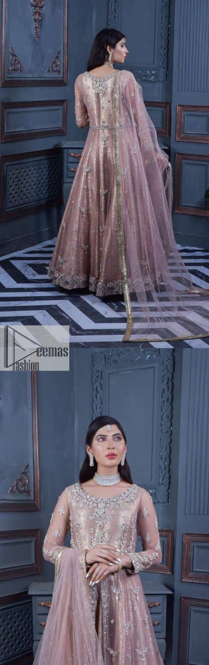 Have style and warmth with this tea rose nikah outfit! The front open maxi is the magic of floral motifs with engaging embellishments on the jamawar fabric, making this an eye-catching ensemble. The following maxi is adorned with tilla, dabka, Kora, Kundan and the real magic of Zardozi. The timeless silhouette is crafted, with floral motifs. The silver embellishments give a glamorous touch to this exquisite attire. In addition to this, the full sleeves are also decorated with floral motifs to make this article bright and charming. The round neckline also adds beauty to the overall look. Finish this article with a dupatta adorned with a four-sided borders and sequins sprayed all over for a perfect and classy look.