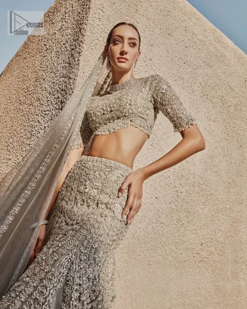 This fusion of floral embroidery is total fashion goodness for a walima outfit! A stunning teal grey organza choli embellished