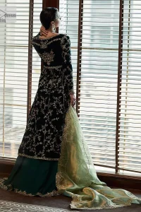 Outfits that define you. DeemasFashion presents the party wear in deep green colour which is adorned with light golden embroidery. It is enhanced with tilla, dabka, kora Kundan and the real magic of Zardozi. The round neckline makes this epitome of beauty. Furthermore, the full sleeves of the front open gown intensify the beauty of the outfit. It is coordinated with a plain lehenga with a border embellished to make you feel fresh and bold at the same time. Complete this attire with a dupatta in ivory colour which is ornamented with a four-sided embellished border to give a royal touch.