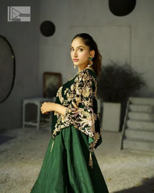 Style. Warmth. Performance & versatility!  This stuns in a beautifully handcrafted green top enshrined with light golden embellishment and detailed