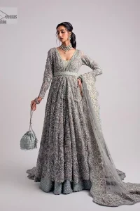 The beautiful mint green reception wear is a breathtaking masterpiece that will give you a magnificent look at the wedding. Lavish embroidery work and hand-crafted embellishments provide a perfect finishing look to this pishwas. It is adorned with silver embroidery which involves tilla, dabka, kora, Kundan and the real magic of zardozi. Further, the V shape neckline makes this masterpiece unique and attractive. The full sleeves are full of floral embroidery patterns. It is paired up with a lehenga with embroidered border to balance the outfit's look. The dress achieves the final elegant look when paired with a delicate dupatta embellished with four-sided scalloped edges and tiny floral motifs all over.