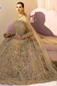 Make a statement wherever you go with a great selection of fawn colours just for you! A beautiful fawn scalloped maxi with a medley of hand-embellished floral motifs and geometric patterns in silver and gold colour. The maxi is enhanced with tilla, dabka, kora, Kundan and the real magic of Zardozi. The V shape neckline makes this walima outfit charming and attractive. Further, the patterns on full sleeves also intensify its loveliness. It is paired with an embellished floral border lehenga served with a scalloped. A net dupatta with sequin spray and intricate borders completes a gorgeous outfit.