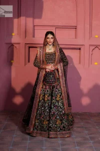 Make your superb days bright and bold! A jet black blouse with floral branches, peacock motifs and Mughal-inspired embellishments with dabka, naqshi, cut dana, Resham, Swarovski, Zardozi, tilla and Kundan. It is supported with a round neckline and full sleeves to make this masterpiece a traditional look. The lehenga has an embellished border around its flare that is complemented and decorated with multiple colour embroidery. It is paired with an organza dupatta in the same colour with a sequin-sprayed surface and intricately embellished borders on all sides.