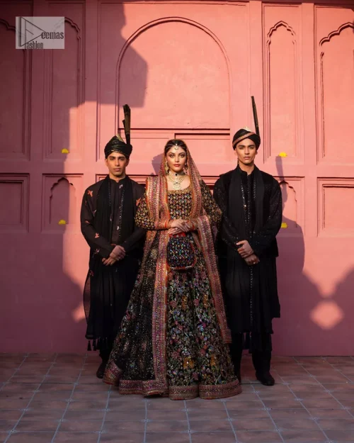 Make your superb days bright and bold! A jet black blouse with floral branches, peacock motifs and Mughal-inspired embellishments with
