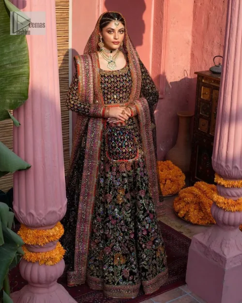 Make your superb days bright and bold! A jet black blouse with floral branches, peacock motifs and Mughal-inspired embellishments with