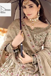 The beautiful floral patterns of this walima wear for versatile you! The?blouse is intricately emblazoned with multiple colour embellishments. Beautiful floral designs on the neckline and full sleeves give an elegant touch to the blouse. It is paired up with a flared lehenga having heavy embroidery to make your day as bright as the colour of the outfit. Graceful details of tilla, resham, sequins, and stones make this beautiful outfit a perfect choice. Complete this outfit with a dupatta framed with four-sided borders and tiny floral motifs all over to make your day versatile and charming.