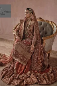 Red is utilised as the dress base colour. The sleeves of the blouse are embellished with floral patterns to make this reception wear the epitome of beauty.