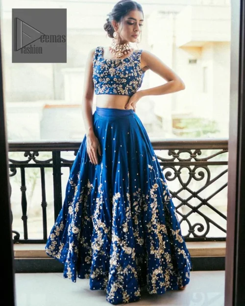 The Royal blue blouse is adorned with silver embroidery, making it a head-turning masterpiece. Moreover, the square neckline is fully