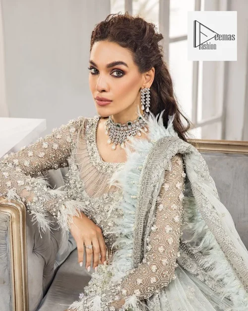 The lehenga is also embellished with beautiful zari work. Complete this article with a dupatta framed with four-sided embellished borders