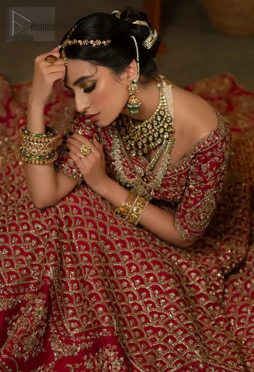 This dress is not like any other – it's a super unique blouse lehenga. Its dark antique and brass shades