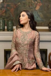 Crafted from the finest fabrics, it is organized with border embellished sharara that gives you grace as you exchange your vows. The classic dupatta in the same color symbolizes the essence of the Nikah