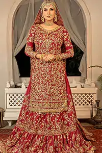 The rich red hue is adorned with intricate golden embroidery that sparkles with every movement.