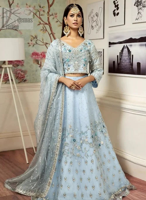 the flowing lehenga complements the overall regal look with scattered sequins and tiny floral motifs. Let your impeccable gorgeousness set