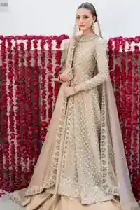 Wide flare and finished edges of light fawn pure tissue silk farshi lehenga bottom.