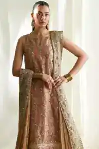 Styled peach long shirt and rose pink gharara for daytime mehndi celebration.