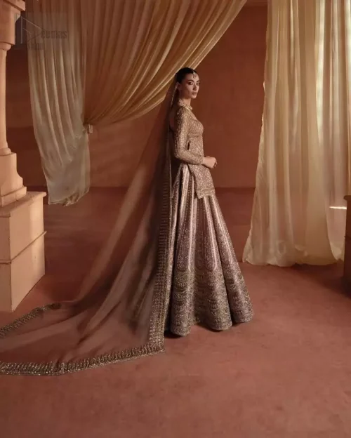 Full Sleeve Artistry: Focus on the full sleeves of the golden tissue silk shirt, adorned with delicate tan threadwork and